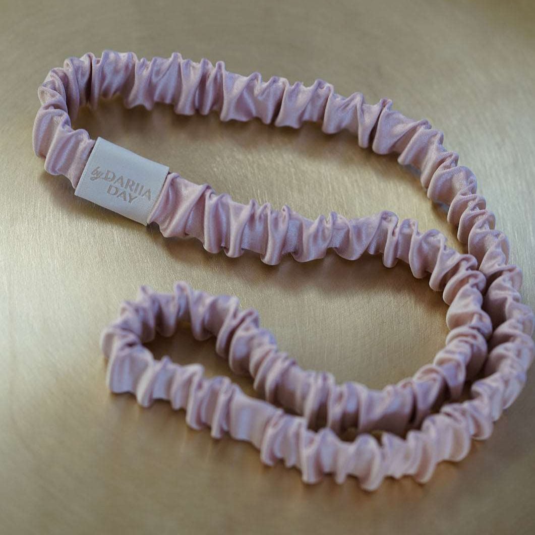 Pink A luxurious blush pink silk headband by Dariia Day, displayed on a golden tray, perfect for adding a touch of elegance to your hair accessories collection