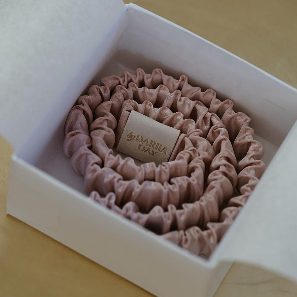 Pink Blush pink silk scrunchie neatly packaged in a gift box by Dariia Day, ideal for hair care and gifting