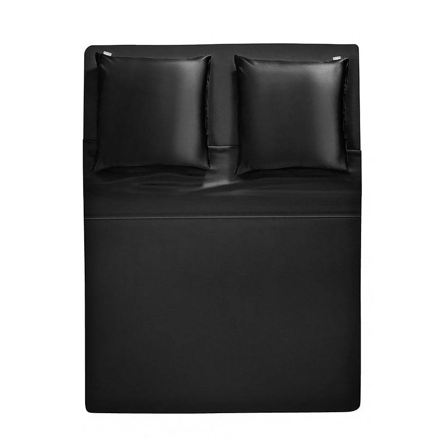 Black Elegant midnight black silk bedding set by Dariia Day, featuring a flat silk bed sheet and matching pillowcases for a luxurious sleep experience.