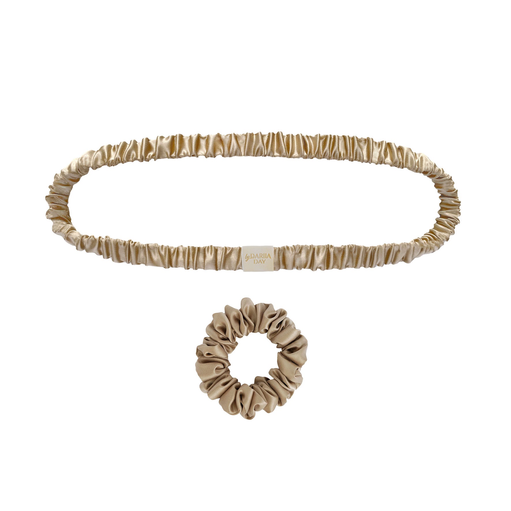 Beige silk scrunchie and headband set by Dariia Day, showcasing a luxurious hair accessory collection in soft, satin-like material.