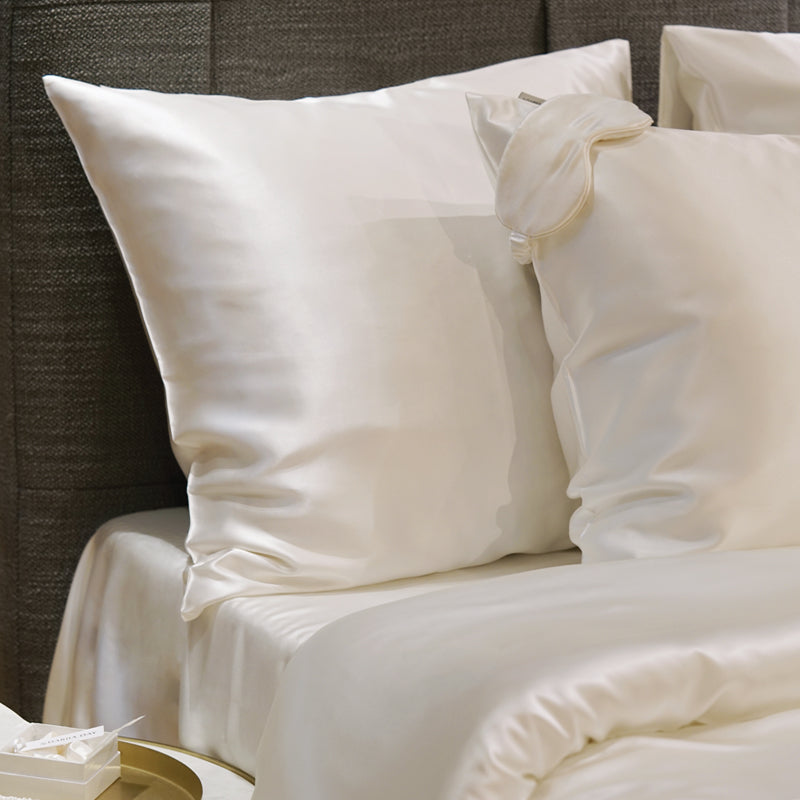 White Elegant Powder White Silk flat sheet draped gracefully over a bed by Dariia Day