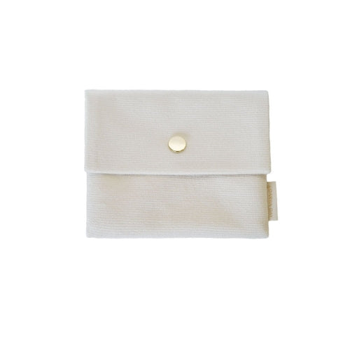 White Dariia Day's powder white travel pouch for the silk face mask, with a simple design and gold button.