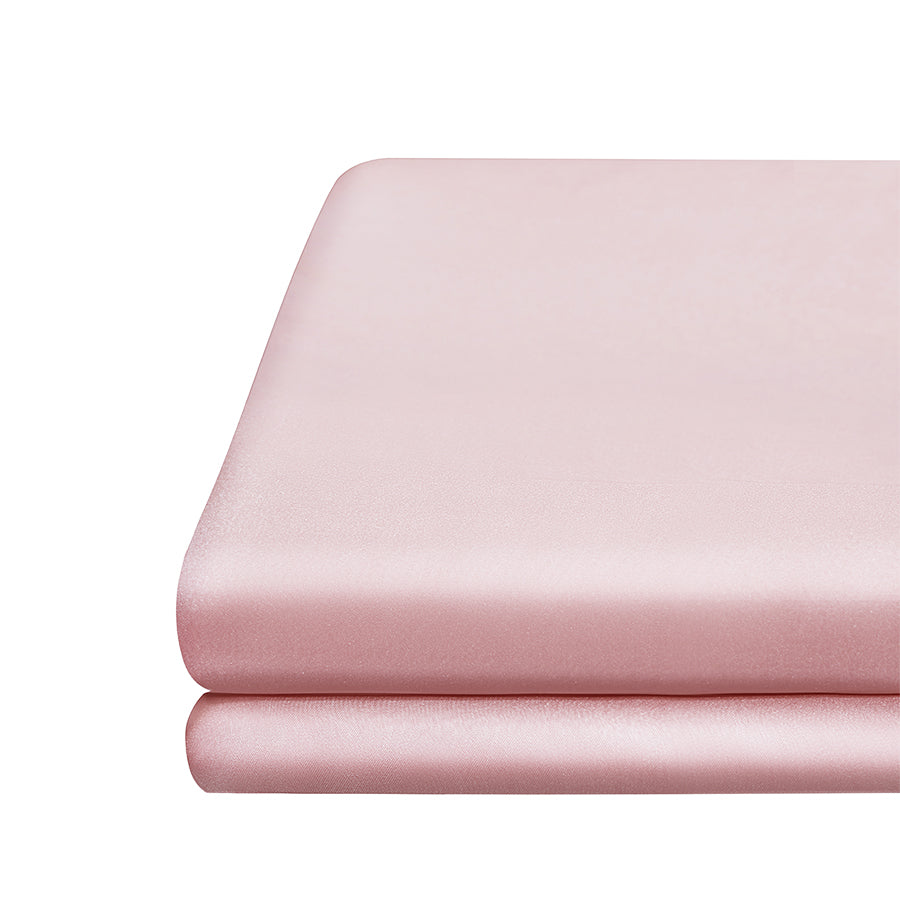 Pink Close-up of smooth mulberry silk fabric in blush pink fitted sheet.
