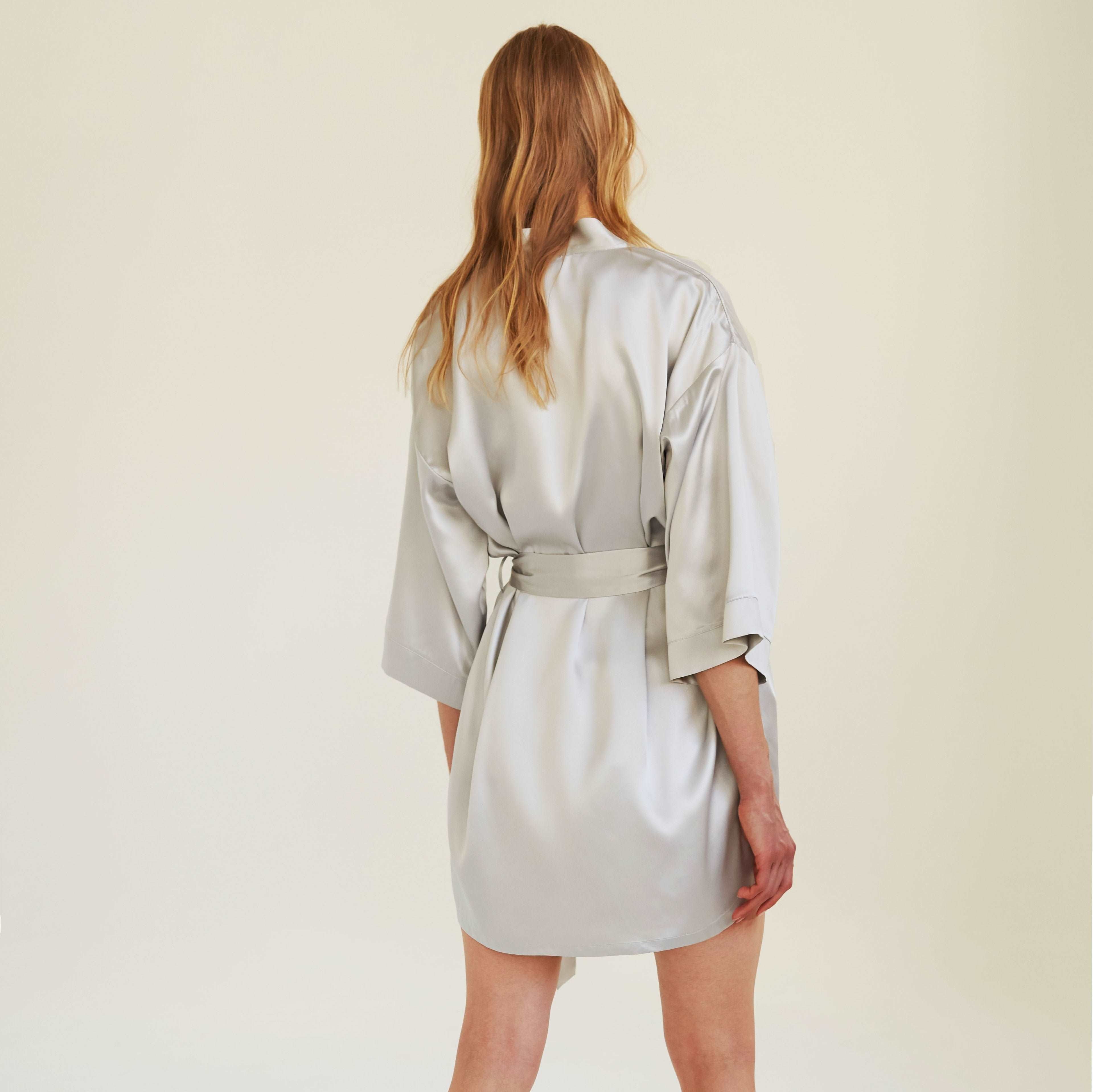 Grey Back view of the silver grey silk robe by Dariia Day, featuring a tie belt and a sleek, flowing design.
