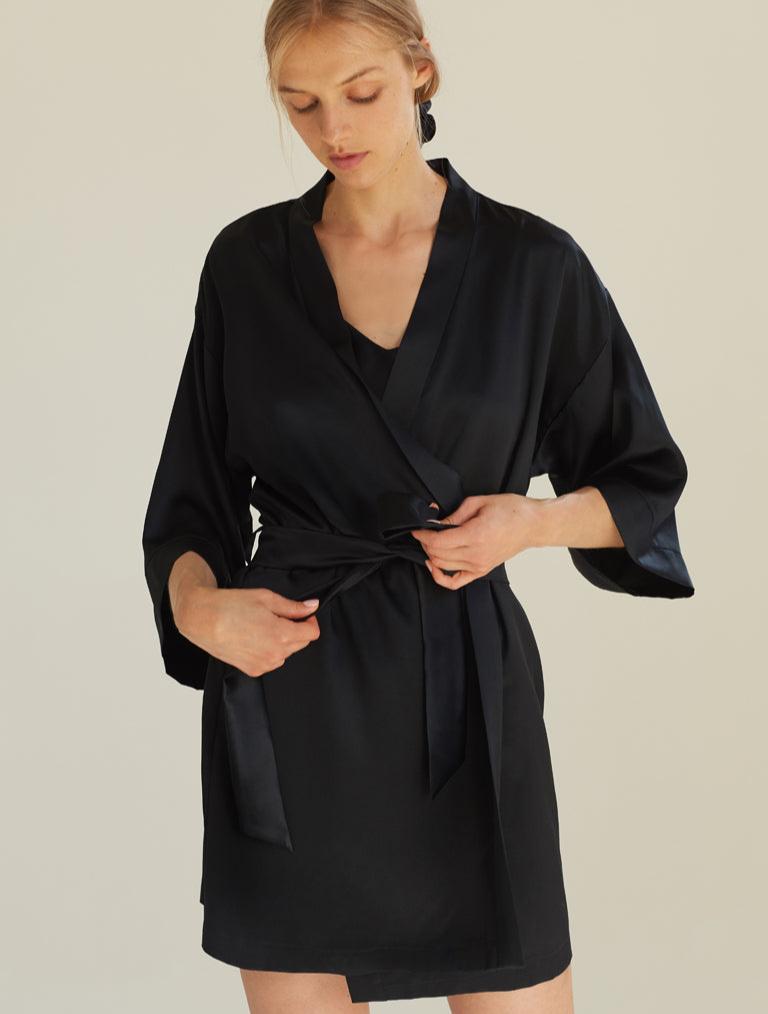 Model wearing a black silk robe by Dariia Day, front view with a tied belt, showcasing the elegance and premium design.