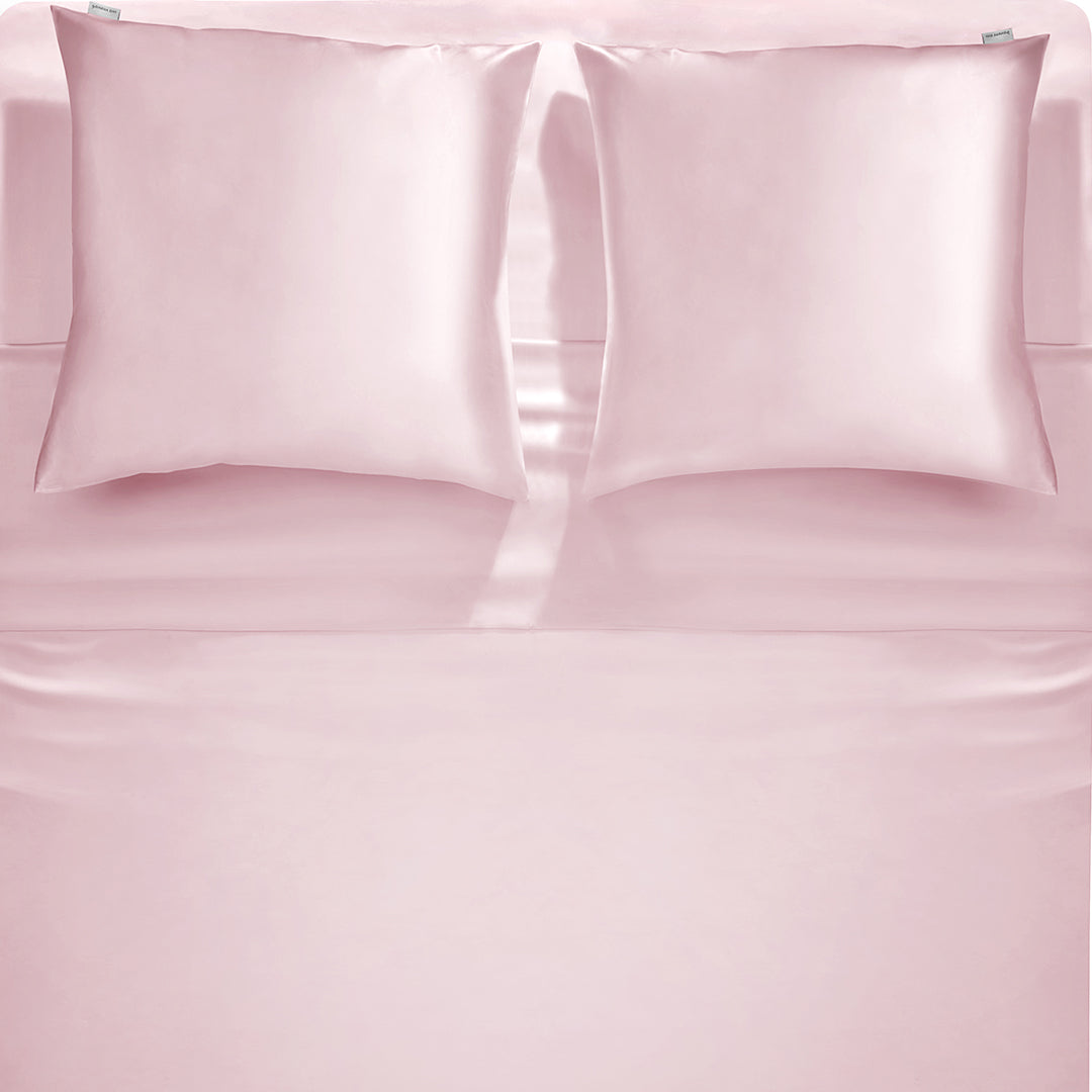 Elegant pink silk pillowcase by Dariia Day, showcasing luxurious bedding for a perfect night’s sleep.