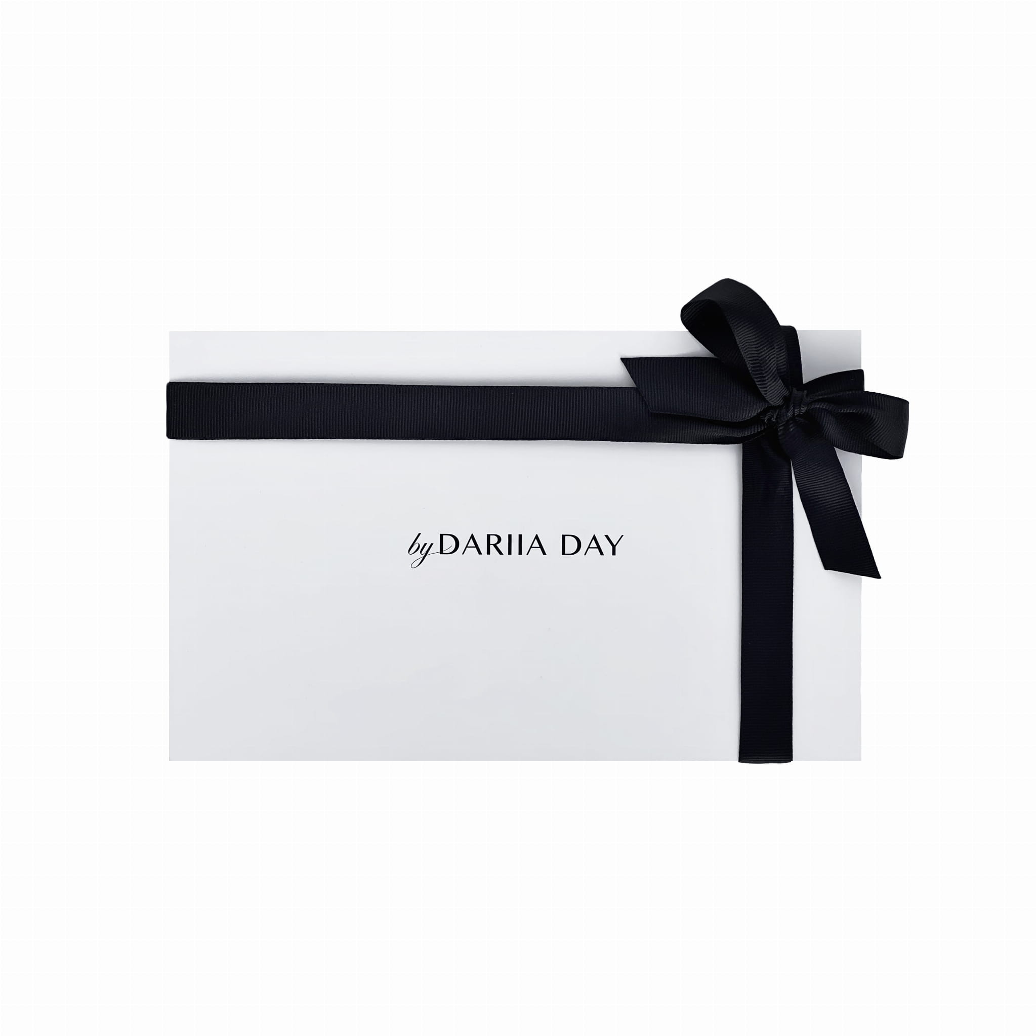 Elegant gift box by Dariia Day wrapped with a black ribbon, perfect for gifting luxury silk pillowcases.