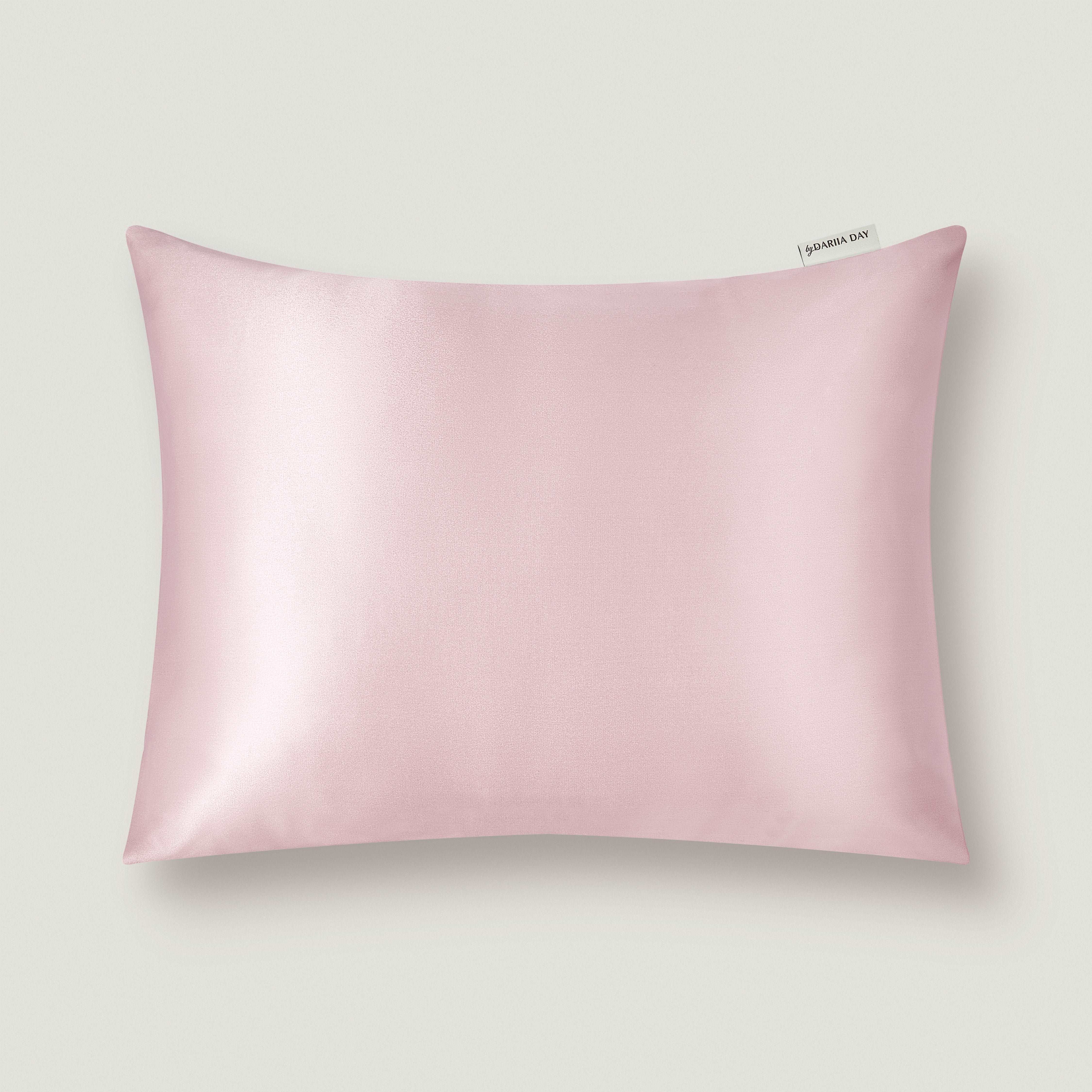 Soft blush pink silk pillowcase by Dariia Day, designed for ultimate comfort and beauty sleep.