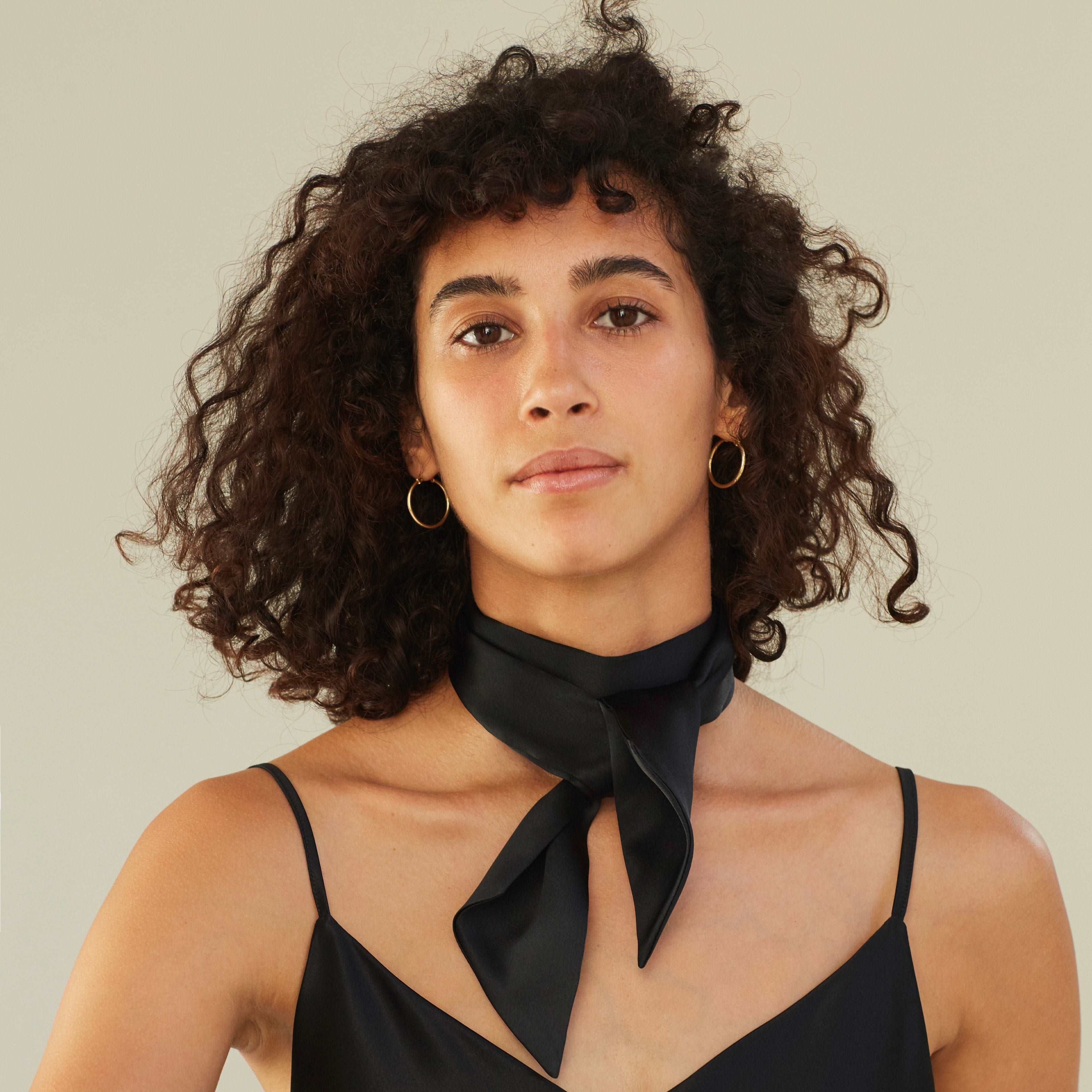 Black Woman with a silk scarf tied elegantly around her neck, midnight black, by Dariia Day