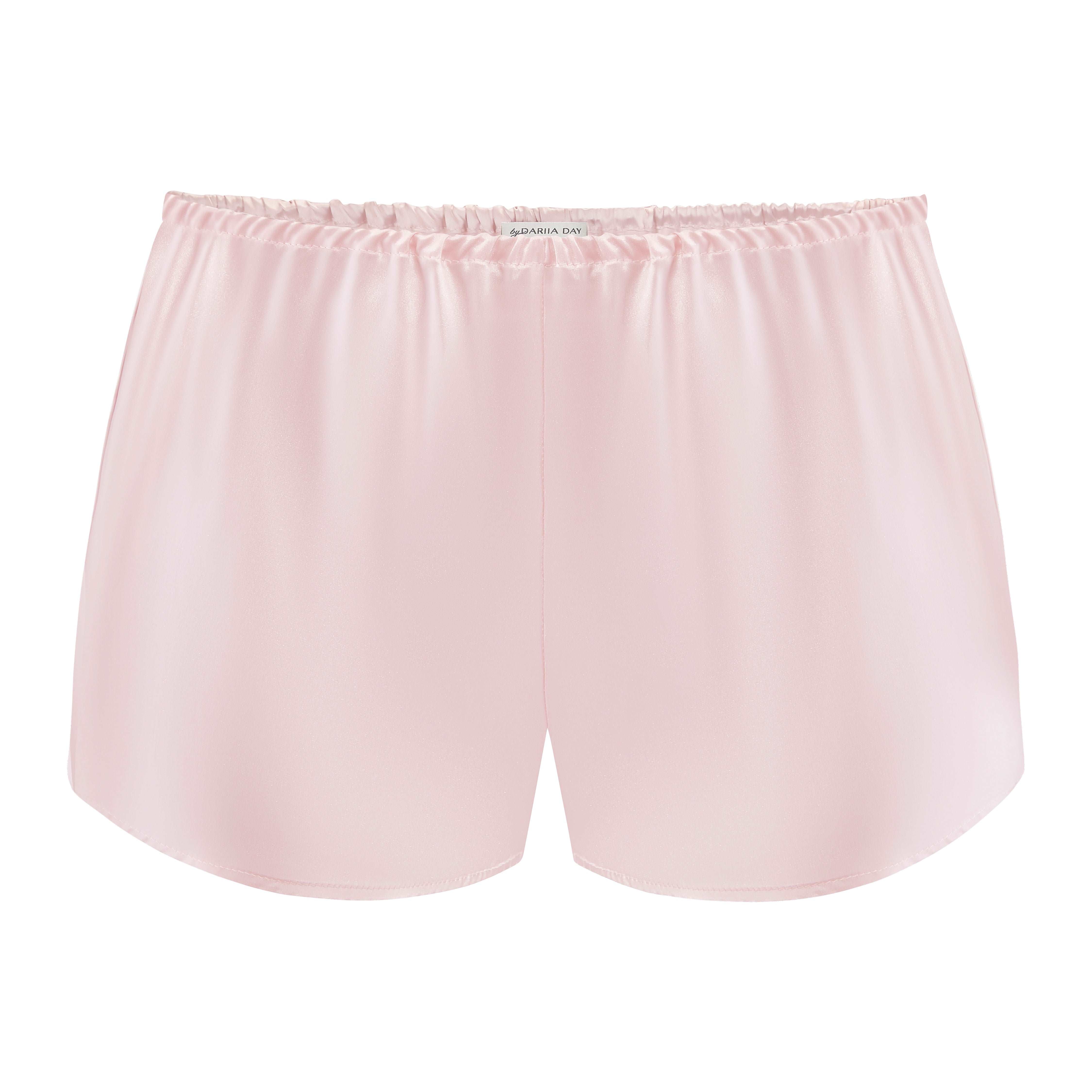 Front view of blush pink silk shorts by Dariia Day, luxurious and smooth finish.