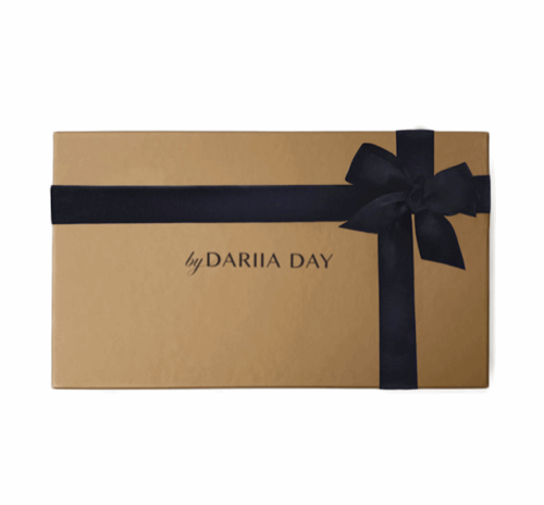 Dariia Day branded gift box with a black ribbon, perfect for presenting luxury items like silk boxers.