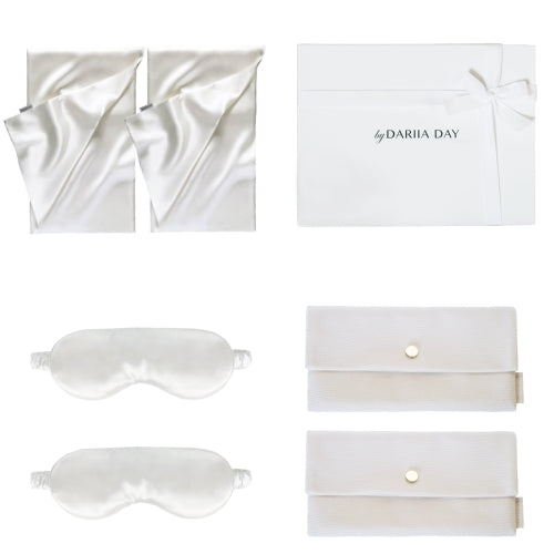 Silk wedding gift set by Dariia Day, featuring two ivory silk pillowcases, eye masks, and velvet pouches arranged in an elegant gift box.