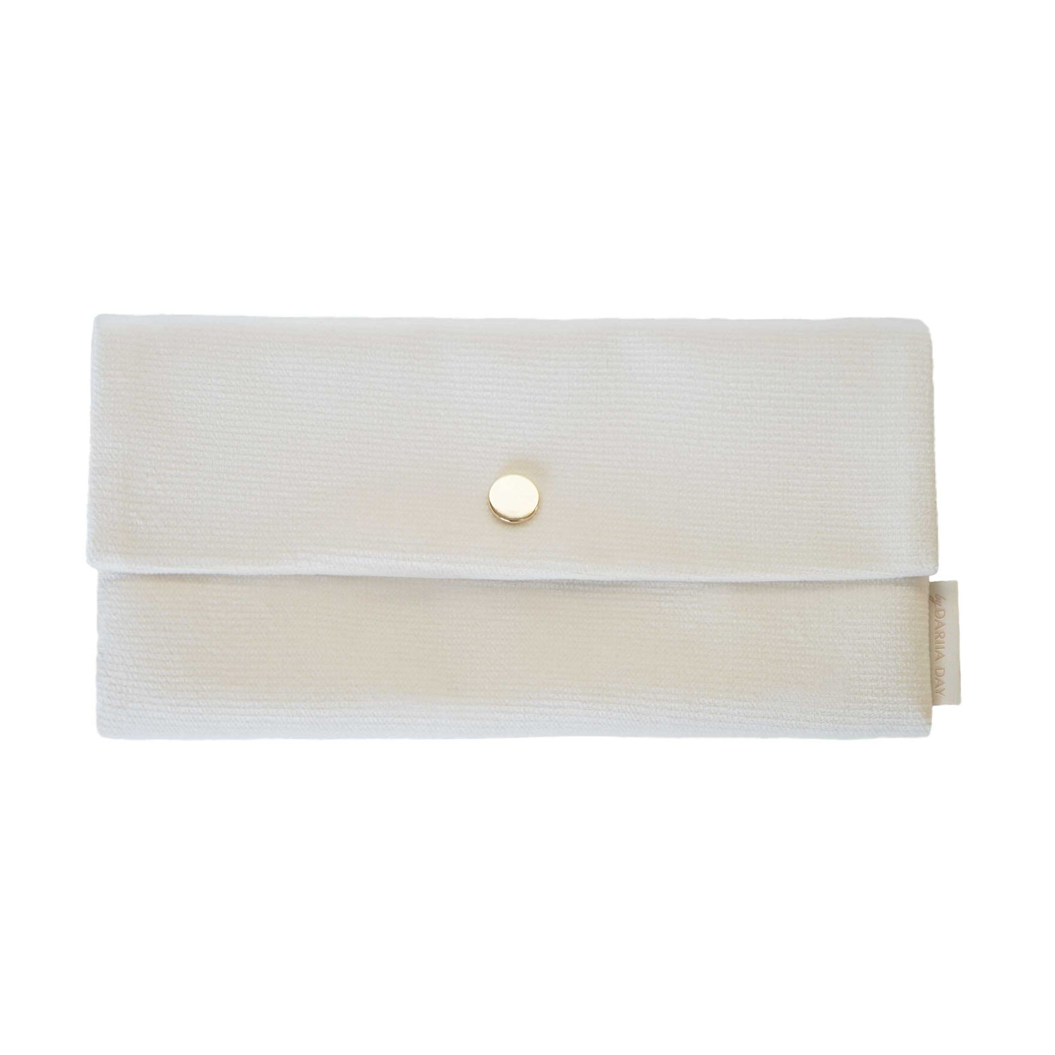 Front view of Dariia Day White Vanilla Velvet Pouch with a gold button and soft texture.