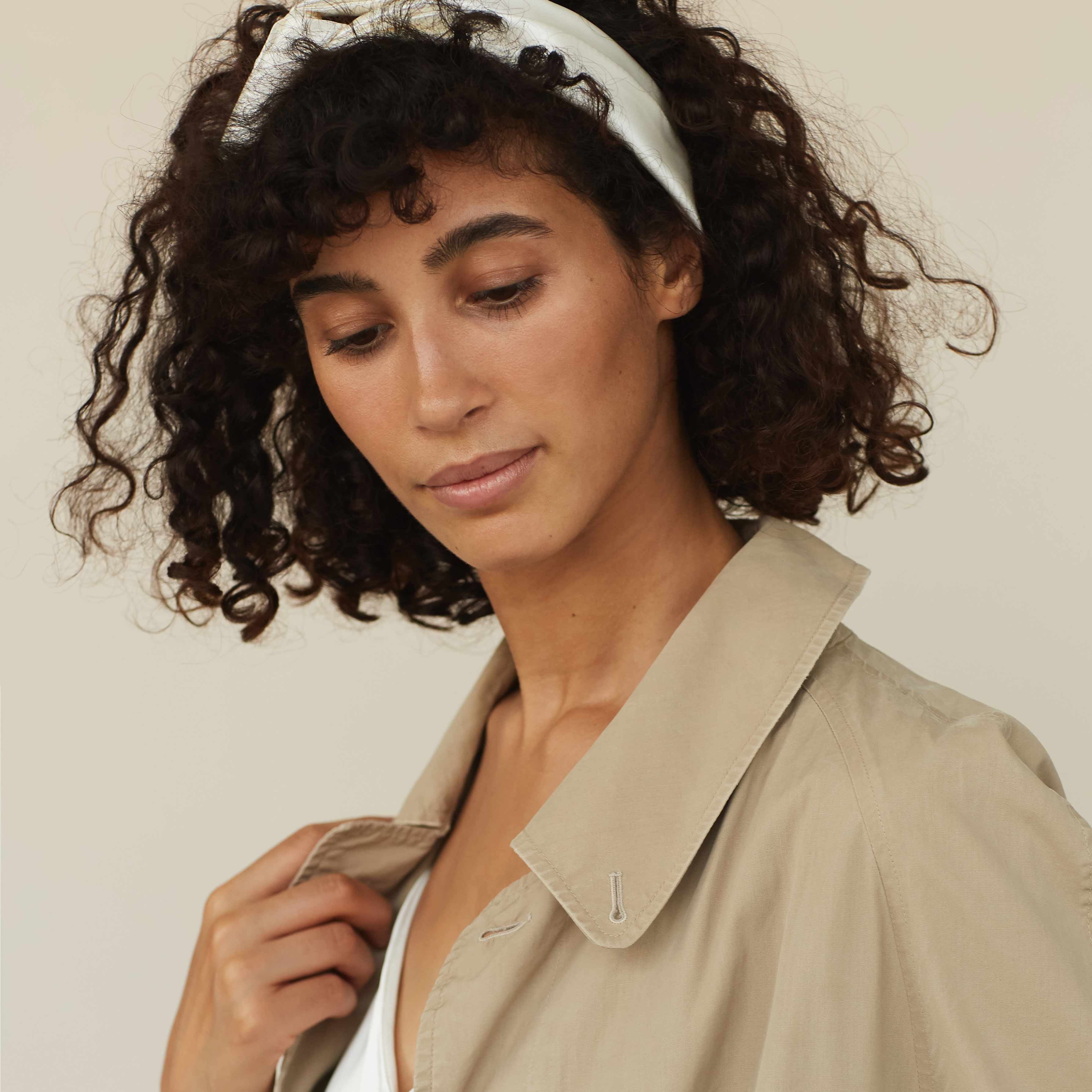 Model wearing a powder white silk scarf as a headband by Dariia Day