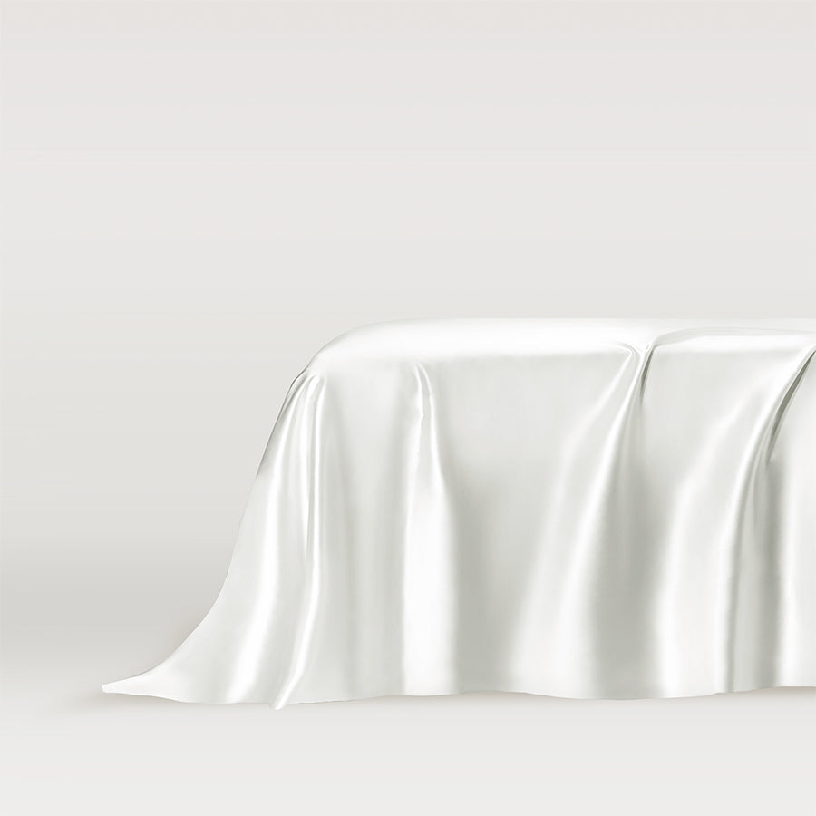 Elegant Powder White Silk flat sheet draped gracefully over a bed by Dariia Day