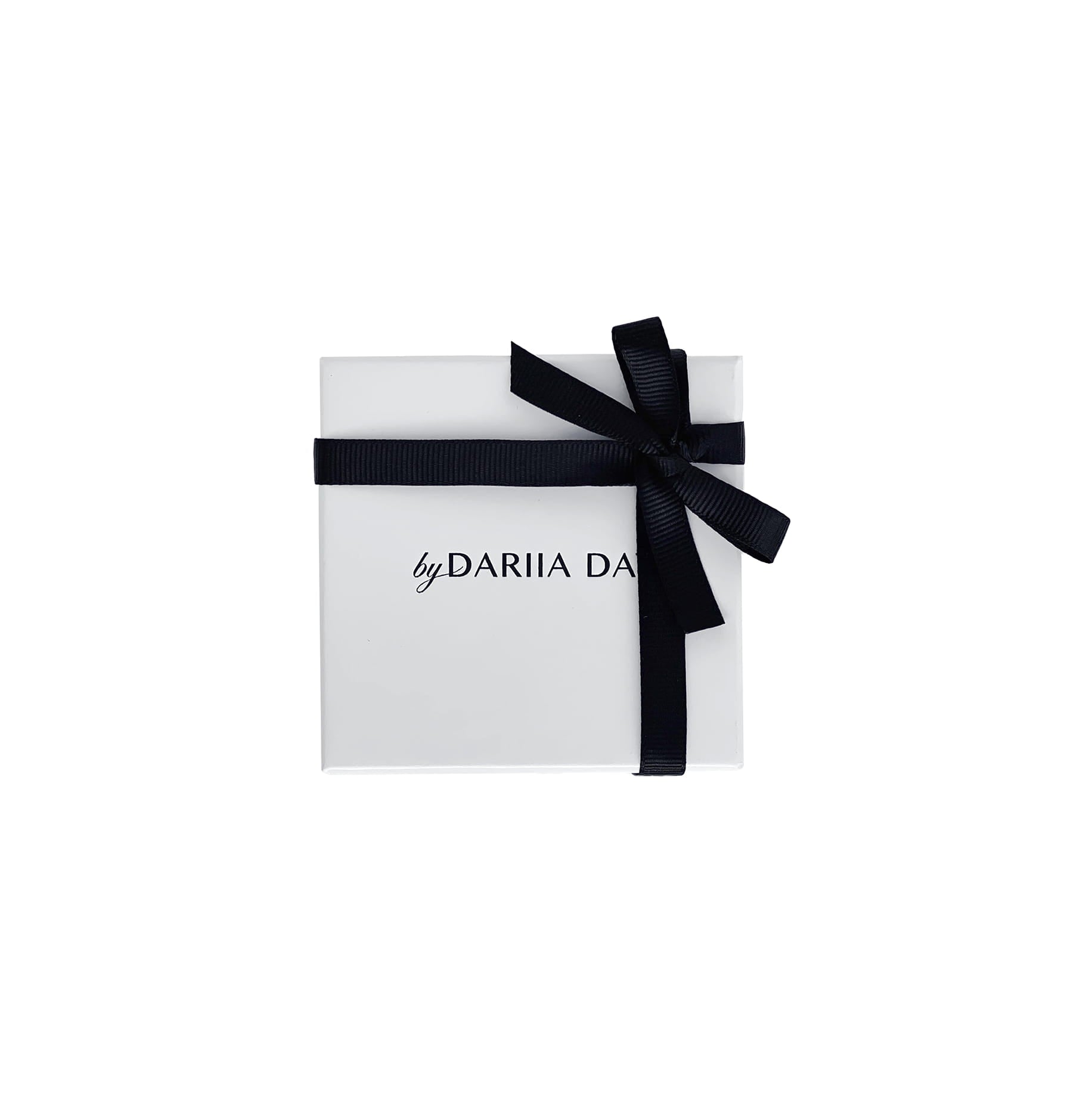 Elegant packaging of a silk scrunchie by Dariia Day with a black ribbon, perfect for gifting