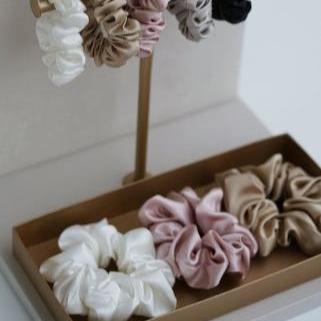 Silk scrunchies displayed, Powder White, Blush Pink, French Beige