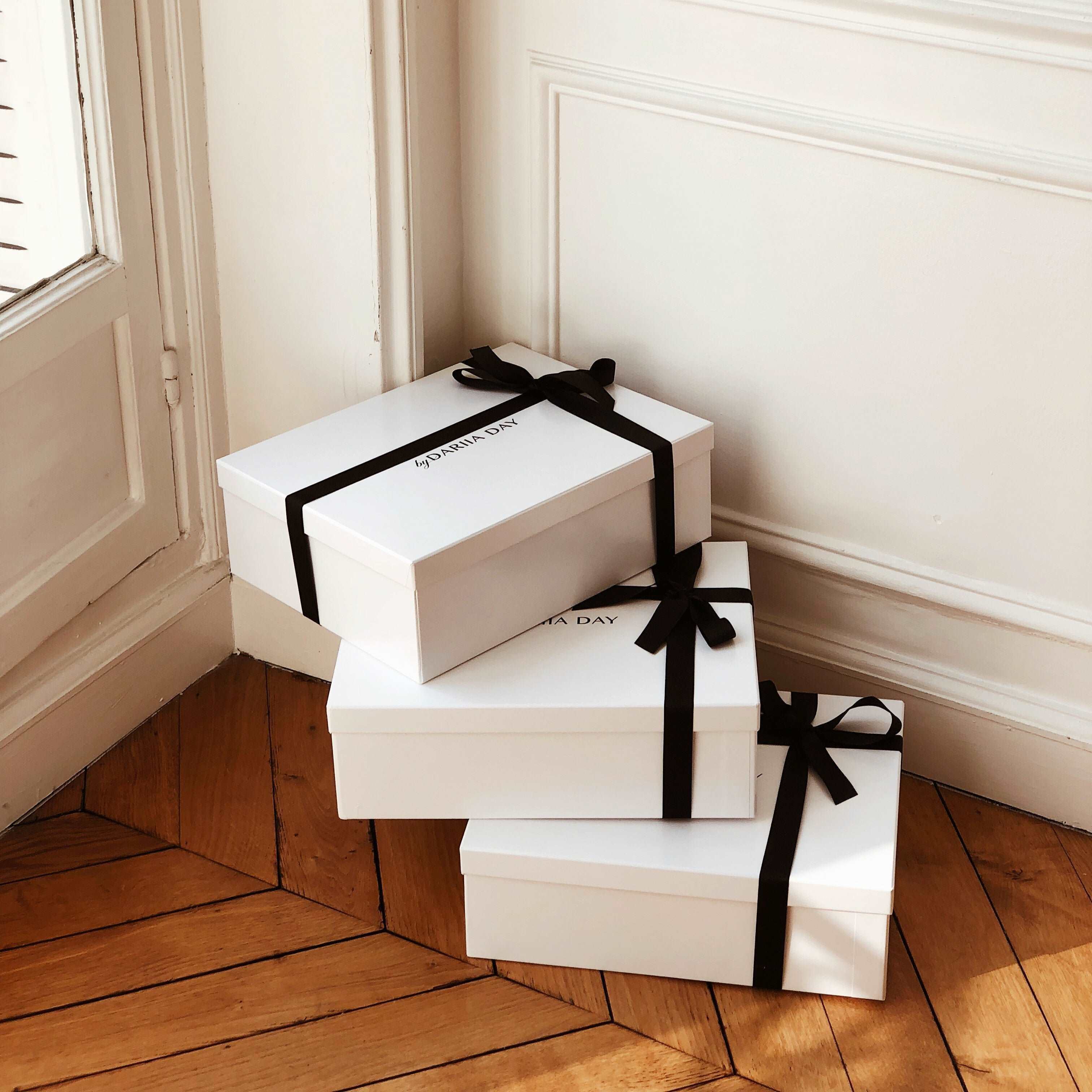 Dariia Day Stacked Silk Gift Boxes with Black Ribbon, filled with Mulberry Silk products